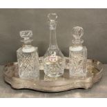 Three crystal decanters on a gilt galleried tray