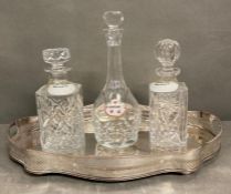 Three crystal decanters on a gilt galleried tray