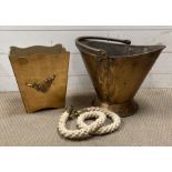 A brass scuttle with a wooden gold painted bin and a rope with brass ends