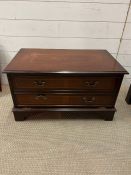 A mahogany style media unit with faux drawers, pulling down to cupboard by Brights of Nettlebed