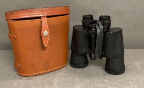 A pair of Ajax binoculars in a brown leather case