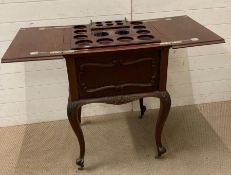 A mahogany drinks caddy and table on castors (H86cm W59cm D56cm)