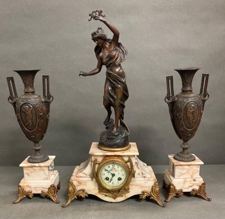 French Art Nouveau mantle clock with a pair of matching vase garniture, white ceramic dial with