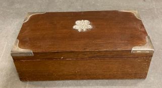 A mahogany jewellery box with silver corner