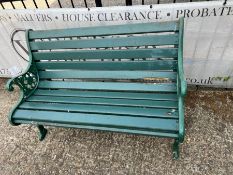 A Victorian style garden bench with cast iron ends