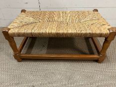 A woven stool on pine frame (H28cm W64cm D35cm)