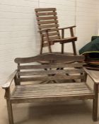 A wooden garden table, chair and bench (Table H67cm Dia102cm) (Bench W130cm H90cm)