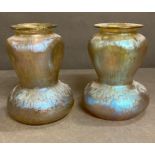 A pair of iridescent glass vases
