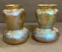 A pair of iridescent glass vases