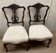 A pair of bedroom chairs