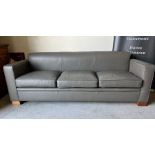 A Three seater grey sofa by designer David Linley H75 x D70 x L210