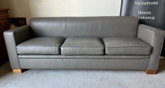 A Three seater grey sofa by designer David Linley H75 x D70 x L210