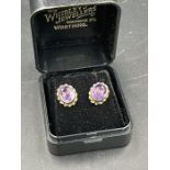 A Pair of gold (untested) and amethyst earrings