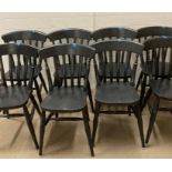 Eight black painted dining Windsor chairs