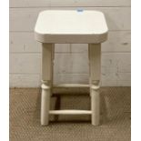 A white painted stool