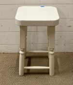 A white painted stool