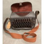 A leather loaders bag, approx 200/250 cartridges with twenty four mounted on the front