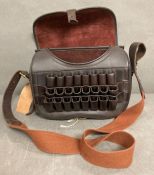 A leather loaders bag, approx 200/250 cartridges with twenty four mounted on the front