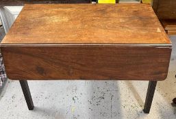 A drop leaf mahogany table