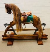 Stevenson Brothers, bright bay rocking horse, very rare in Burr Oak features London tan leather
