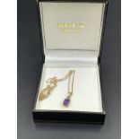 An amethyst and diamond pendant on 9ct gold and 9ct gold chain