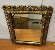 A scrolling gilt frame mirror 36cm x 41cm