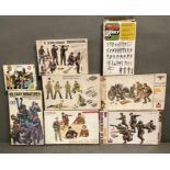 Eight boxed army model kits