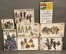 Eight boxed army model kits