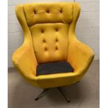 A Mid Century wing back rocking/swivel arm chairs (missing cushion)