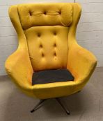A Mid Century wing back rocking/swivel arm chairs (missing cushion)