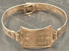 An identity bracelet inscribed J A Finch 3174 HMAS Huon.