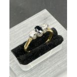 An 18ct yellow gold sapphire ring with diamond shoulders Size L1/2 (2.6g)