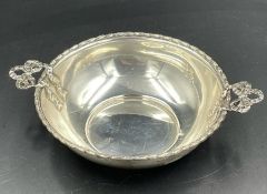 A hallmarked silver porringer with bow handles by The Alexander Clark Manufacturing Co, hallmarked