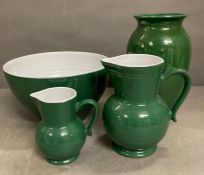 A selection of ceramics to include two jugs, bowl and a vase all in green