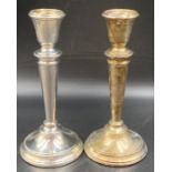 A Pair of silver candlesticks, hallmarked for Birmingham 1964, Height 15 cm.