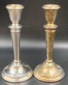 A Pair of silver candlesticks, hallmarked for Birmingham 1964, Height 15 cm.