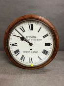 A mahogany wall clock by Dyson