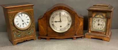 A selection of three mantle clocks, one walnut and two light oak