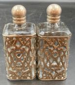 A Pair of white metal encased scent bottles