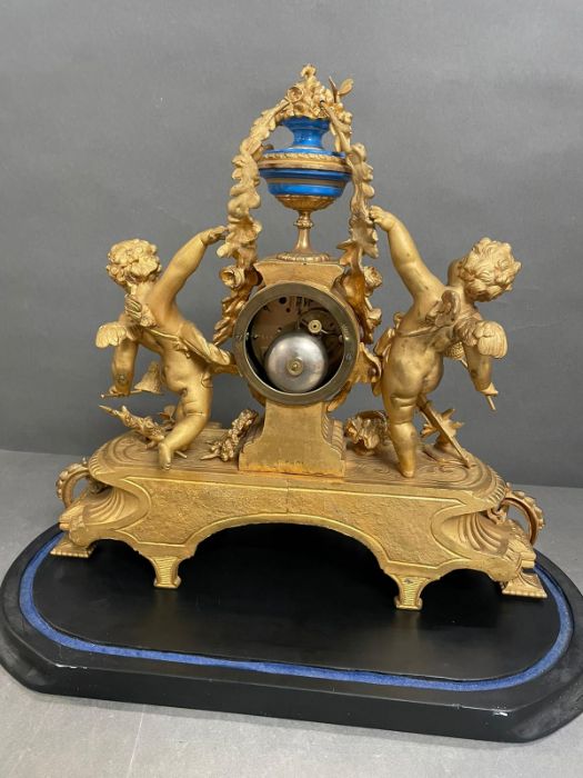 An Eight day Ormolu and enamel eight day clock featuring cherubs and under a glass dome. - Image 7 of 9