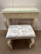 A white dressing table and stool