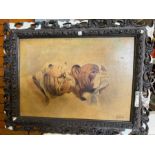 A print of to Bulldogs in carved frame, signed