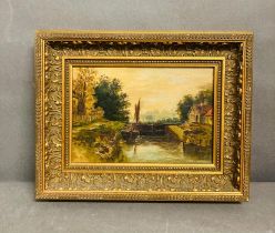 A framed oil on canvas of a river scene (36.5cm x 29cm)