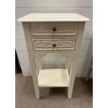 A white bedside with two carved drawers (H70cm W37cm D26cm)
