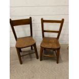 Two wooden children's chairs
