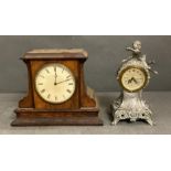 Two mantel clocks, one in an oak case