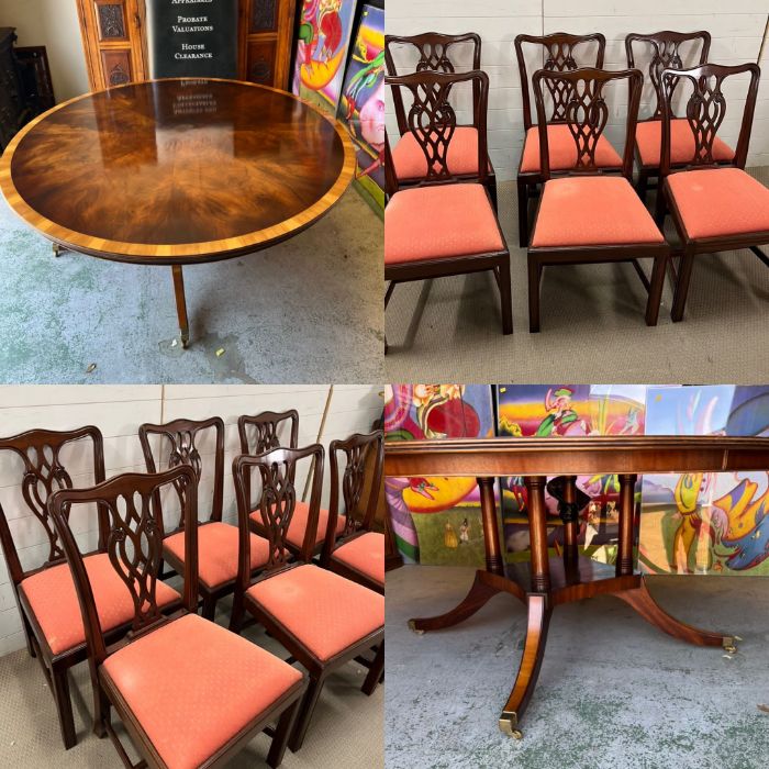 A George III style dining table and chairs with shaped backs, pierced vase splats on square legs