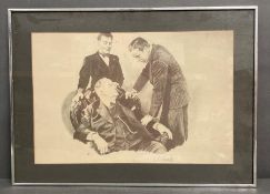 A signed print of Humphrey Bogart, Peter Lorre and Sydney Greenstreet in the Maltese Falcon
