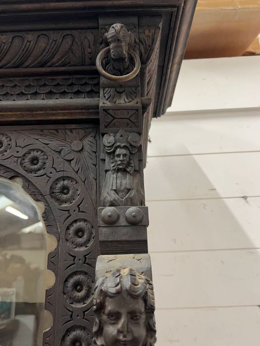 A Gothic inspired glazed bookcase cabinet with carved lion heads to each corner with brass rings and - Image 2 of 10