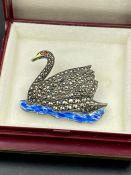 A Marcasite and enamel brooch in the form of a swan.